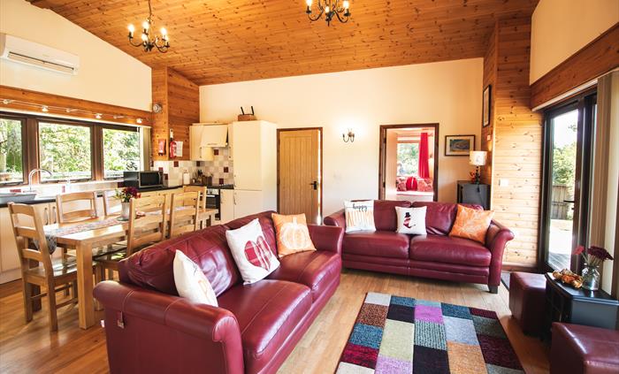 Lounge area with smart TV and a view across the countryside.